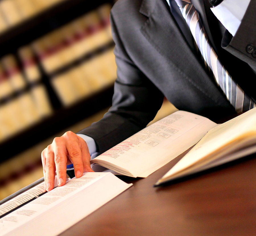 Man in library with book